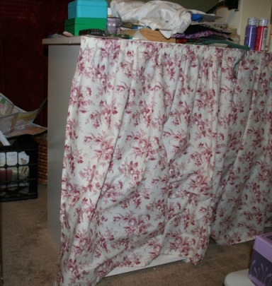 Sewing table with curtain